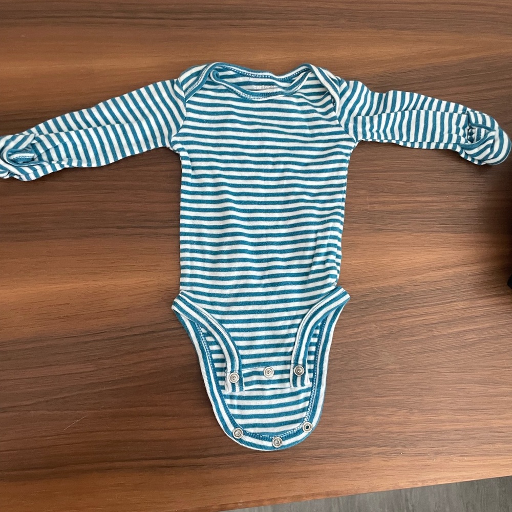 Newborn clothes barely worn all washed and clean. No stains, or tears.